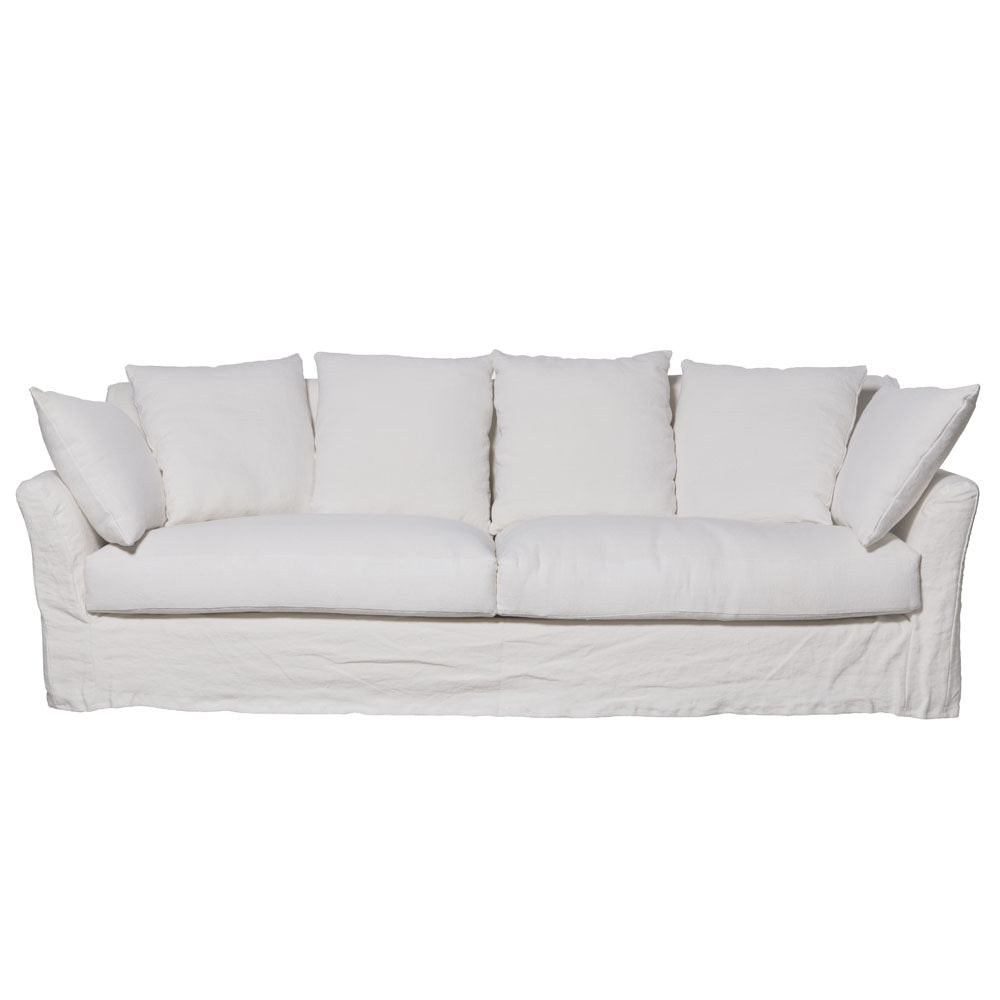 Sofá de tres plazas con funda textil y cojines sueltos